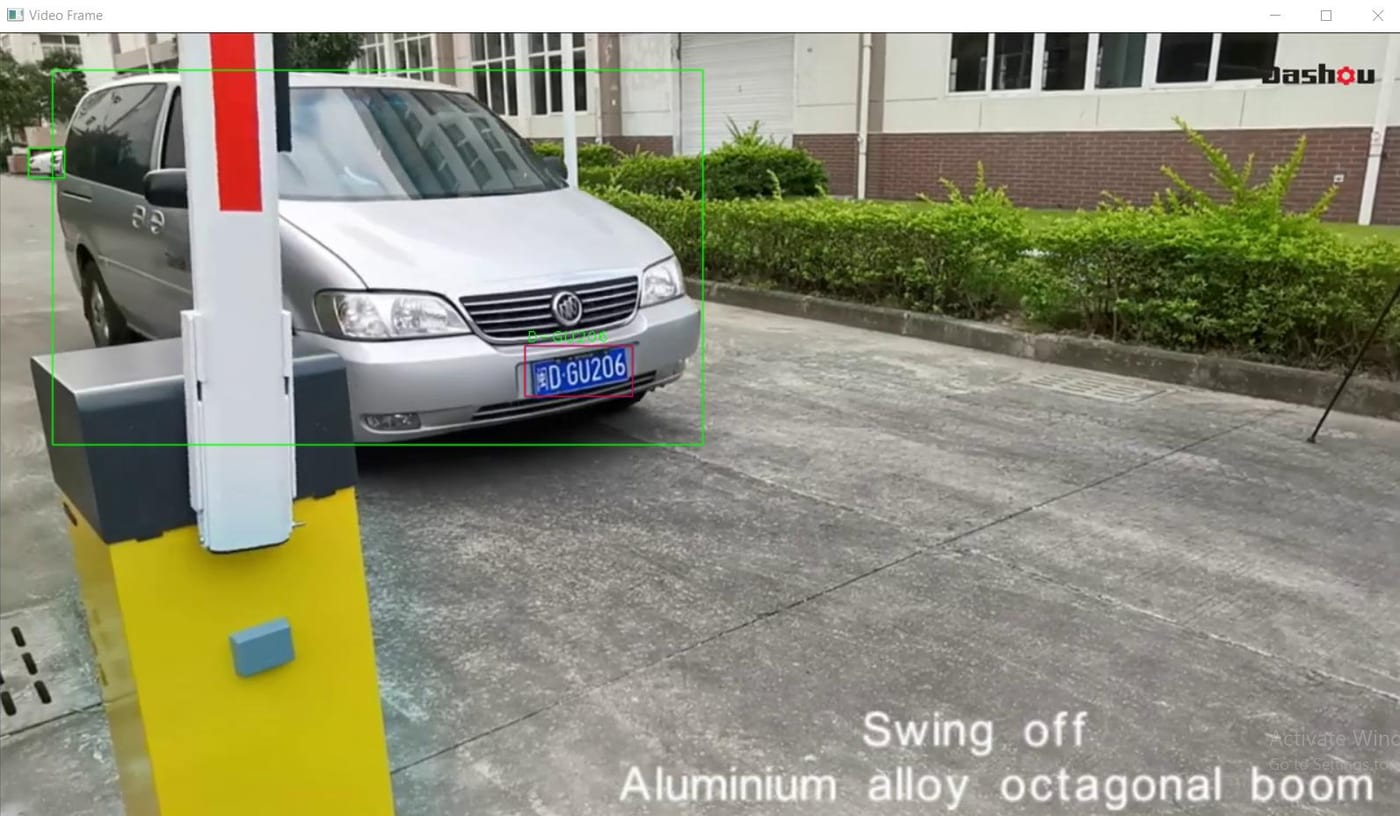 A vehicle detected at an automatic aluminium boom barrier to trigger the gate.